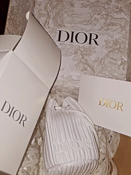 Dior Handbags - Dior White Quilted Drawstring Bucket Bag with Embossed Logo